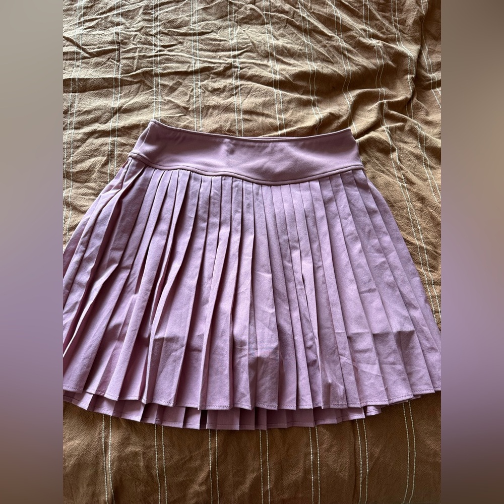 Pleated pink sports skirt